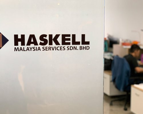 Interior glass partition with Haskell signage in the Haskell Malaysia office
