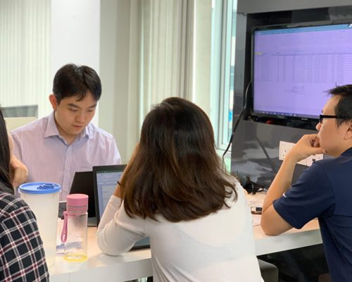 Haskell Malaysia employees seated at a meeting table